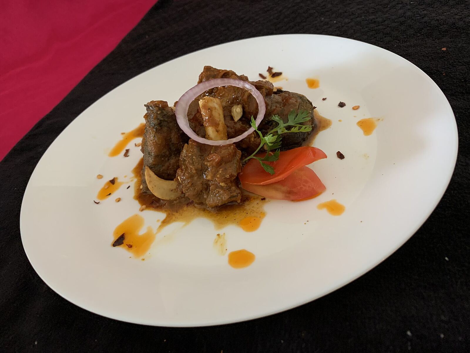 Ready dish Patvelia portioned on two different plates and photos taken from different angles, with variety of presentations