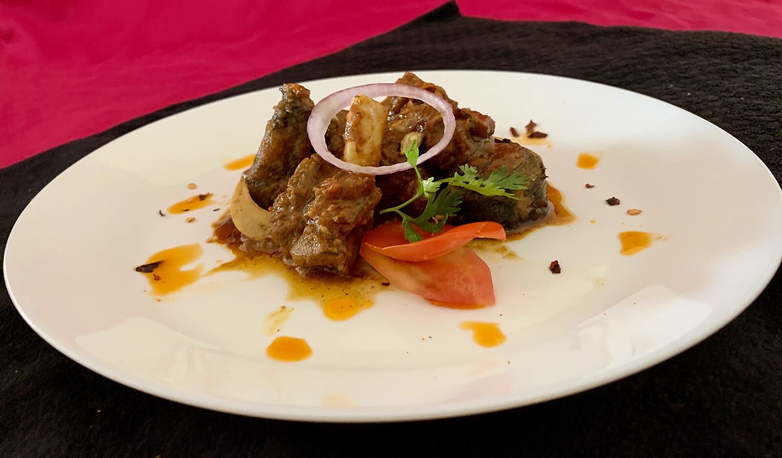 Ready dish Patvelia portioned on two different plates and photos taken from different angles, with variety of presentations